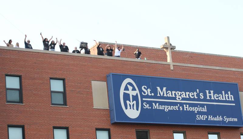 St. Margaret's employees gather on the rooftop of St. Margarets's Hospital for a gathering on Friday, June 16, 2023 in Spring Valley.