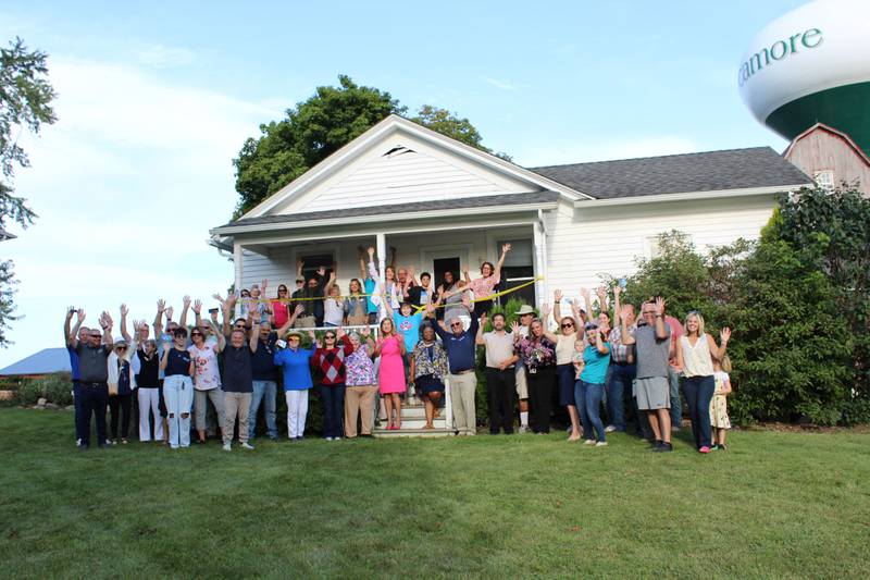 The DeKalb Chamber of Commerce celebrating Habitat for Humanity of DeKalb County's “Hired Hands House" impending move