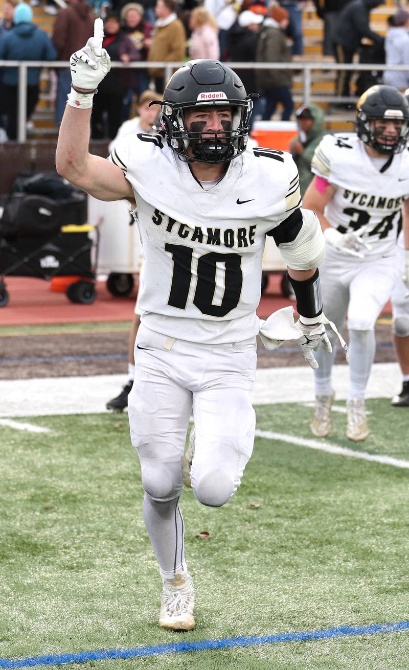 Sycamore's Zack Crawford celebrates after their Class 5A second round playoff win over Carmel Saturday, Nov. 5, 2022, at Carmel Catholic High School in Mundelein.