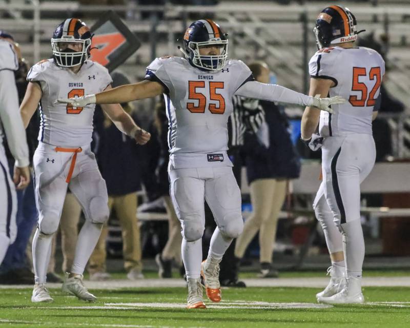 Oswego's Anthony Perez celebrates a big defensive stop during football game between Oswego at Plainfield North.  March 26.  Gary E Duncan Sr for Shaw Local.