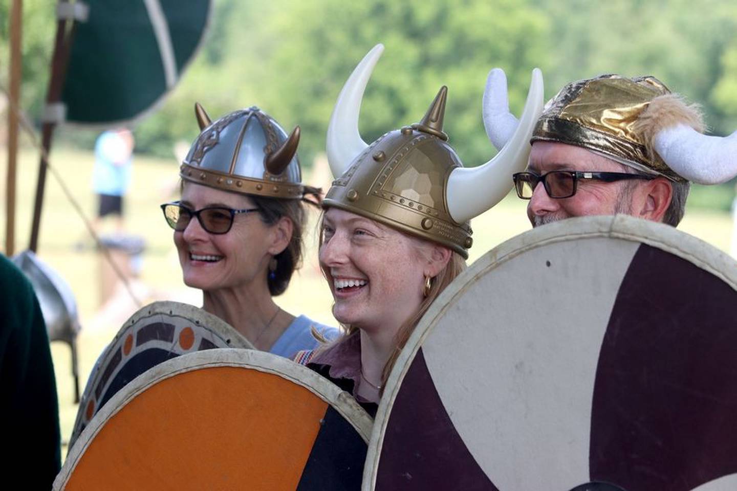 Visiting from St. Louis, Kristine Mothershead -- along with daughter Sasha Mothershead and husband Lenny Jones -- don Viking gear for a photo op during the 113th Swedish Day Midsummer Festival at Good Templar Park in Geneva Sunday. "I'm originally from Geneva, so this is great," Jones said.