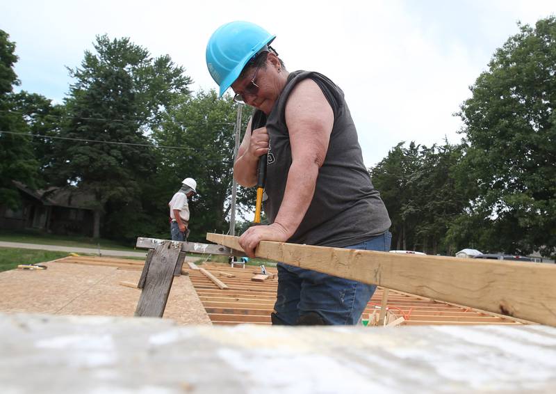 Karen Sellers of Princeton, volunteers while working on the Habitat for Humanity home on Thursday, July 10, 2025 in Princeton. The home is located near the intersection of Cherry and Marquette Street in Princeton. A family of 6, including 4 young children, will move into the home. Volunteers interested in helping with the home are asked to contact to Habitat for Humanity La Salle, Bureau, Putnam Counties by contacting the Peru office. The home should be completed by the end of the year.