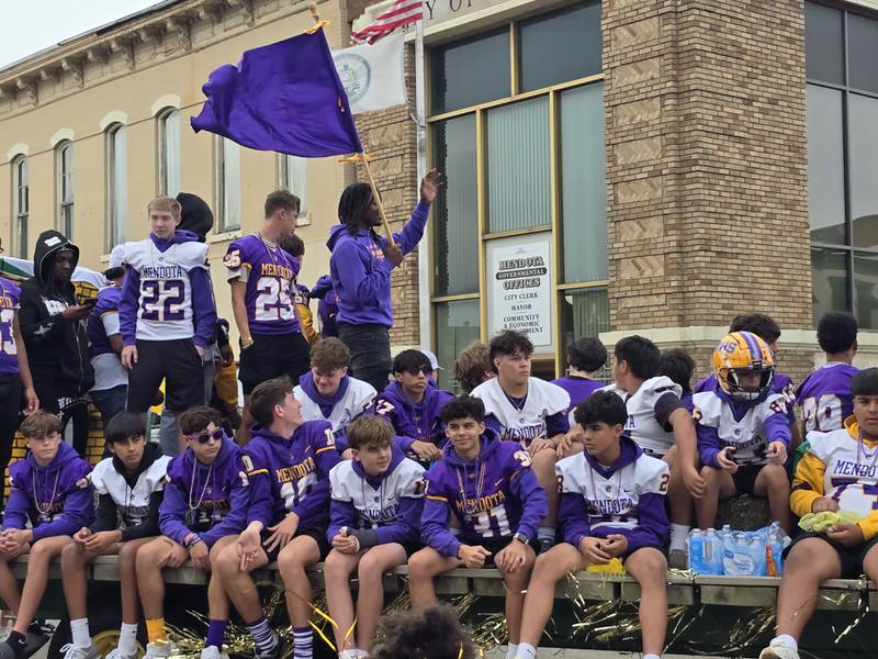 The Mendota High School football team rides through Friday, Sept. 27, 2024, the homecoming parade.