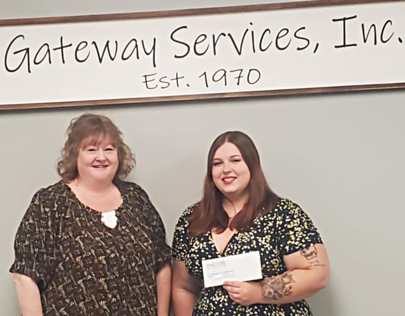 Tracy Wright, CEO of Gateway Services, is pictured with Kaylee Dowda after presenting her $2,500 scholarship check.
