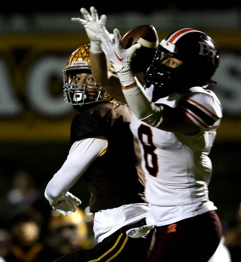 Brother Rice's Nicolas Matejko tries to catch a pass intended for Jacobs' Nick True during a IHSA Class 7A first round playoff football game Friday, Oct. 28, 2022, between Jacobs and Brother Rice at Jacobs High School in Algonquin.