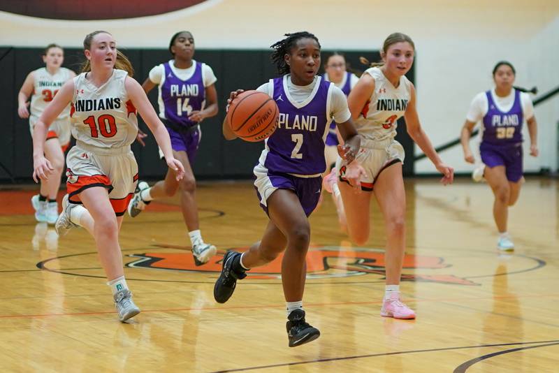 Plano’s Sanai Young (2) drives to the basket off of a fast break against Sandwich during a game Tuesday, Dec. 3, 2024, at Sandwich High School.