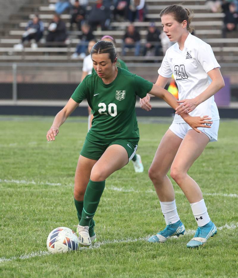 Kaneland's Erin Doucette (right) tries to get the ball away from Boylan's Kassandra Jimenez Wednesday, May 28, 2025, during their Class 2A sectional semifinal game at Belvidere High School.
