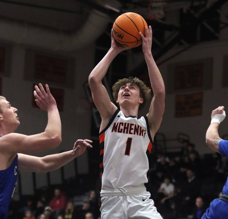 McHenry’s Dylan Hurckes snags a rebound against Burlington Central in varsity boys basketball on Tuesday, Feb. 4, 2025, at  McHenry High School  in McHenry.