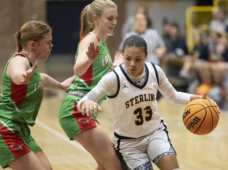 Sterling’s Joslynn James handles the ball against LaSalle-Peru Tuesday, Dec. 3, 2024, at Sterling High School.
