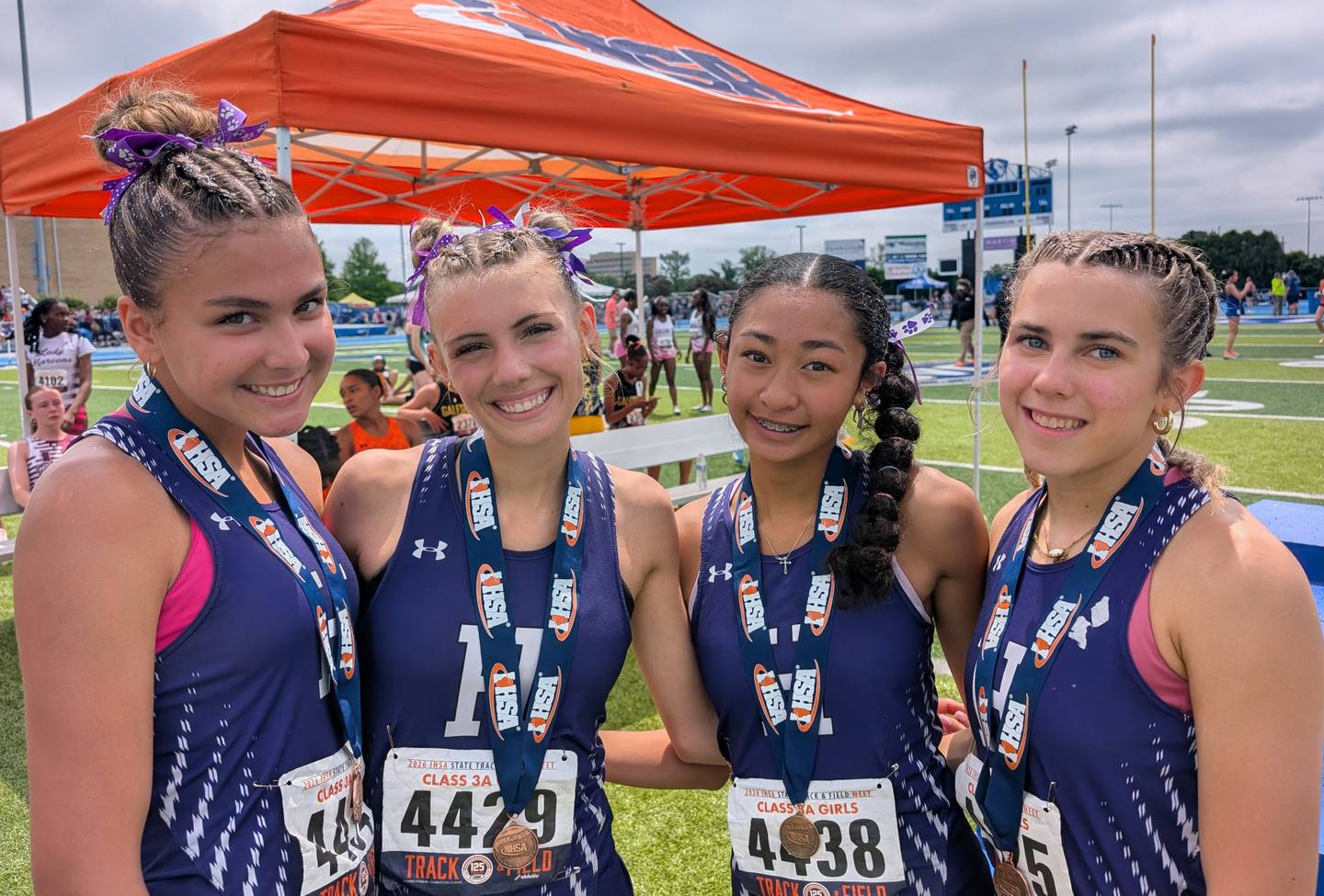 Hampshire's 4x800-meter relay team of (from left) Reese Long, Annabelle Haskins, Miya Moraga and Alyssa Garcia pose for a photo after finishing eighth in Class 3A during the IHSA Girls Track and Field State Meet on Saturday, May 23, 2026, at Eastern Illinois University in Charleston.
