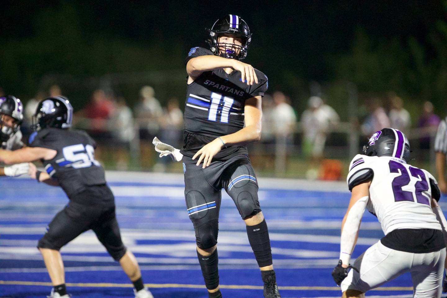 St. Francis's Alessio Millvojevic throws a pass against Downers Grove North on Friday, August 25, 2023 in Wheaton.