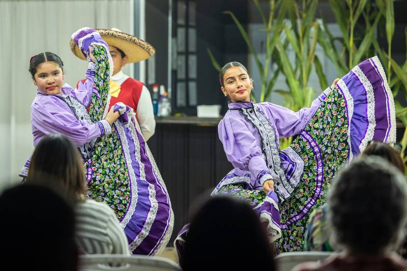 (from left) Inocencia Madrigal and Evelin Hernandez perform dance at the 'Where Our Paths Meet' screening event on Sunday, Sep 7, 2025 at Diaz Banquet Center in Mendota.