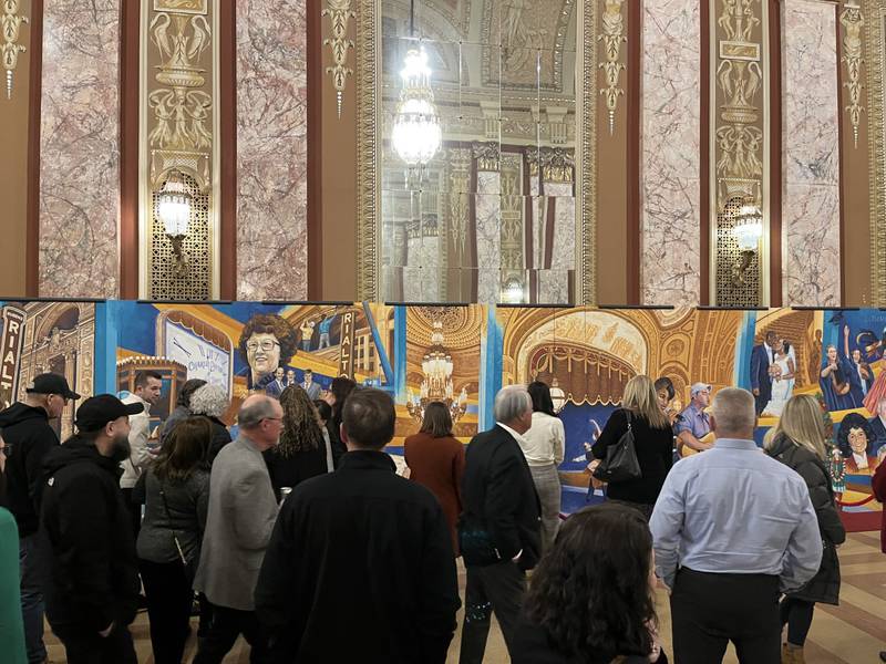 Approximately 100 people came out to a private unveiling of the Rialto Square Theatre’s “Twin Centennial” mural on Monday. The Route 66 Rialto Twin Centennial Mural, painted by Joliet-area Dante DiBartolo, honors both the Rialto and Route 66. Both will turn 100 years old in 2026. The mural encapsulates the Rialto's history.