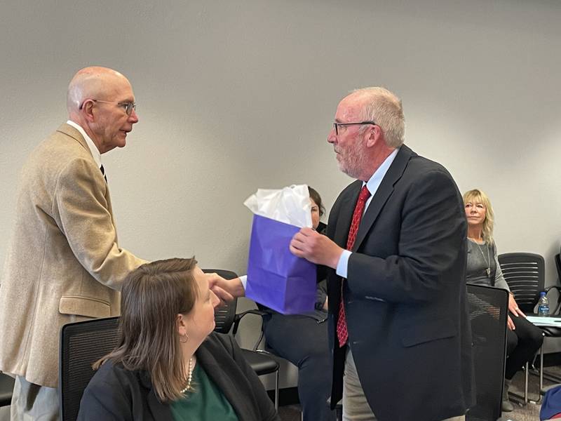 Illinois Valley Community College President Jerry Corcoran opened the meeting Tuesday, April 25, 2023, by honoring outgoing trustee Bill Hunt. Trustee Amy Boyles is seen in the foreground.