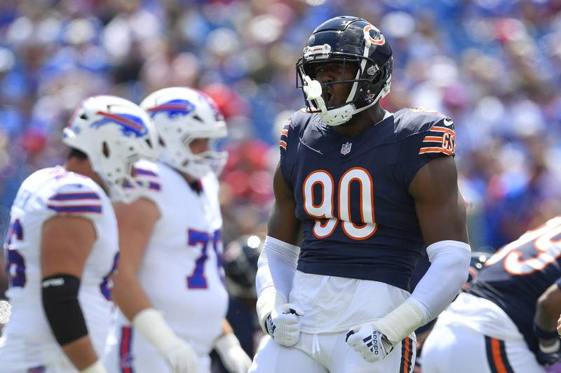 Chicago Bears defensive lineman Dominique Robinson (90) celebrates a stop during the first half of a preseason NFL football game against the Buffalo Bills in Orchard Park, N.Y., Saturday, Aug. 10, 2024. (AP Photo/Adrian Kraus)