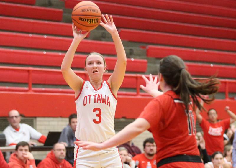 Ottawa's Skylar Dorsey sinks a three-point basket over Yorkville's Brooke Spychalski on Monday, Dec. 4, 2023 at Kingman Gym.