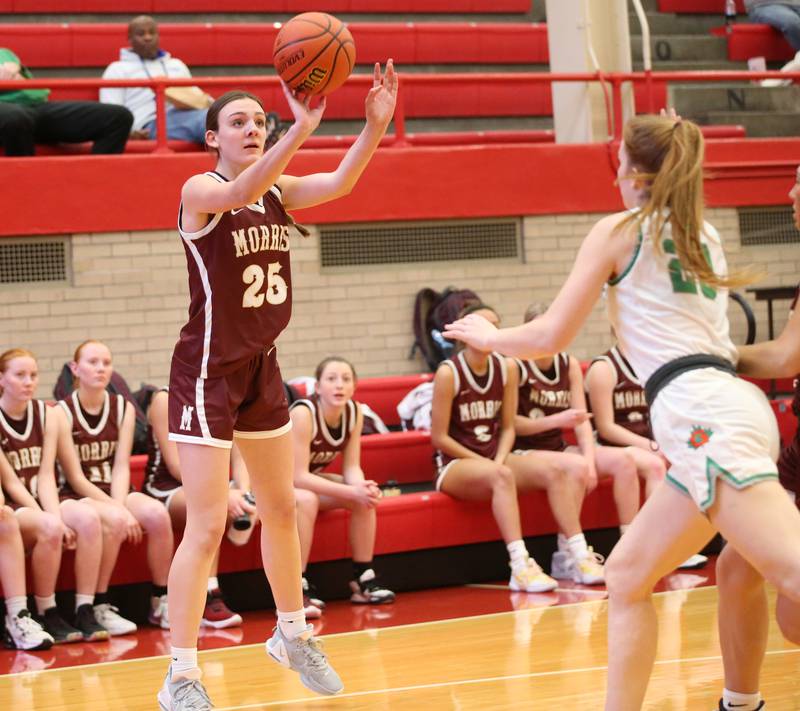 Morris's Lily Hansen shoots a jump shot over Geneseo's Johanna Fulcher during the Class 3A Regional basketball game on Tuesday, Feb. 14, 2023 at Ottawa High School.