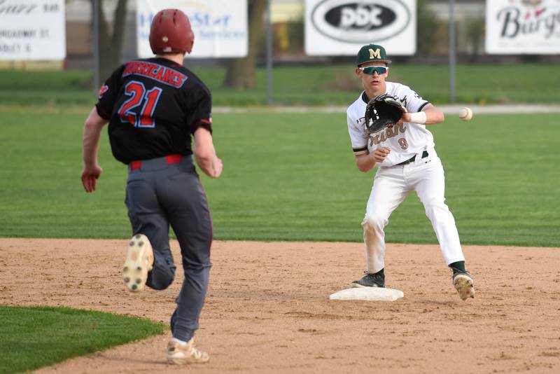 Bishop McNamara's Nick Pignatiello, right, fields a throw at second base ahead of Marian Central's Conor Brandt during a game at Bishop McNamara Friday, April 17, 2026.
