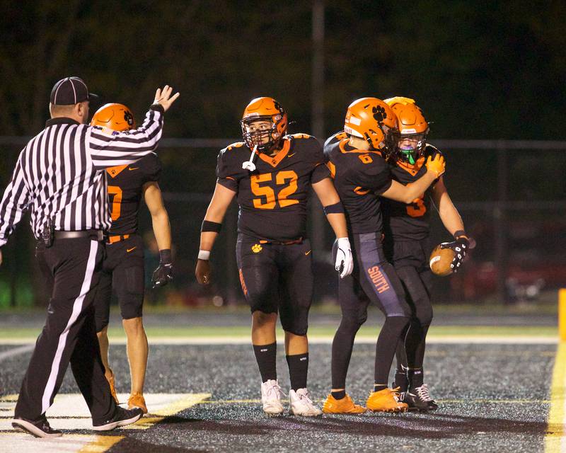 Wheaton Warrenville South celebrates a touchdown against St. Charles North on Friday, Oct. 10, 2025 in Wheaton.on Friday, Oct. 10, 2025 in Wheaton.