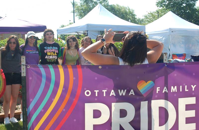 A group have their picture taken at the Jordan block in downtown Ottawa during the Ottawa Family Pride Festival on Saturday, June 10, 2023.