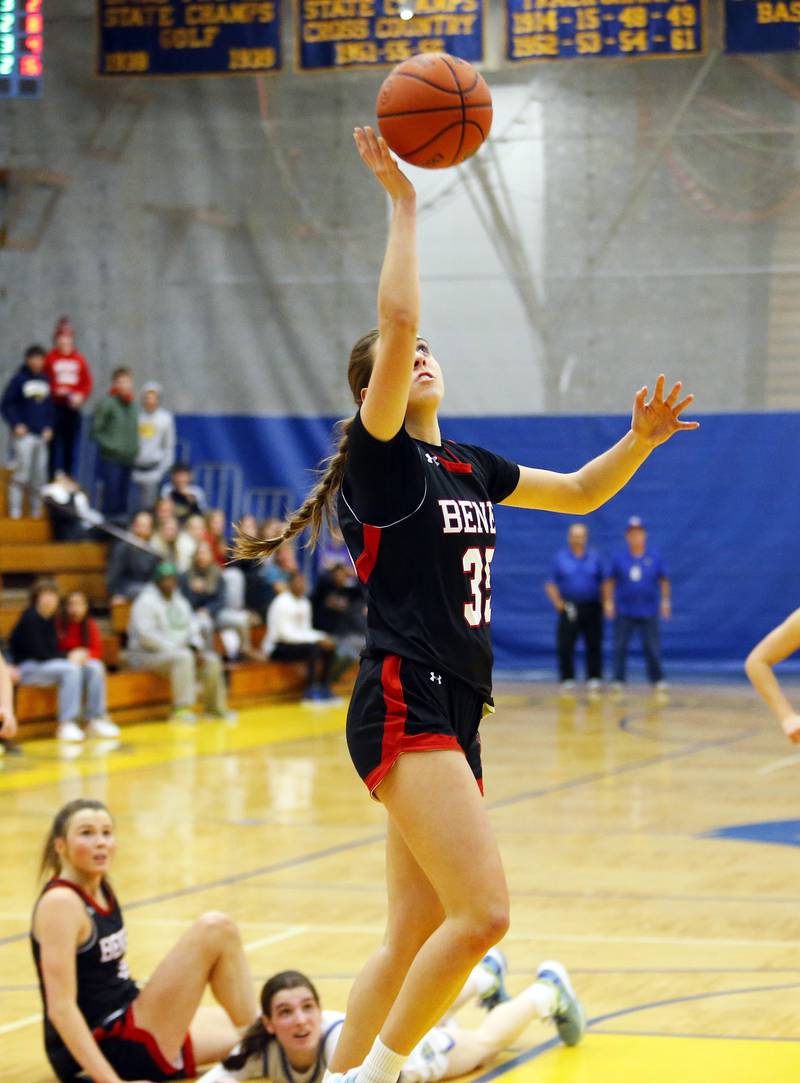 Benet's Emilia Sularski (35) drives to the basket with what proved to be the game winning shot during the girls varsity basketball game between Benet Academy and Lyons Township on Wednesday, Nov. 30, 2022 in LaGrange, IL.