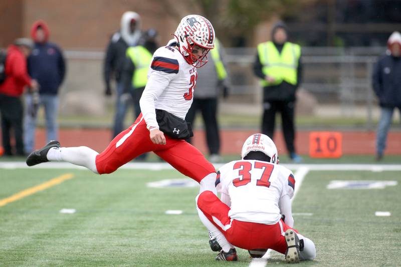 St. Rita's Conor Talty (31) kicks an extra point during their 7A quarterfinal game against St. Charles North in St. Charles on Saturday, Nov. 12, 2022.