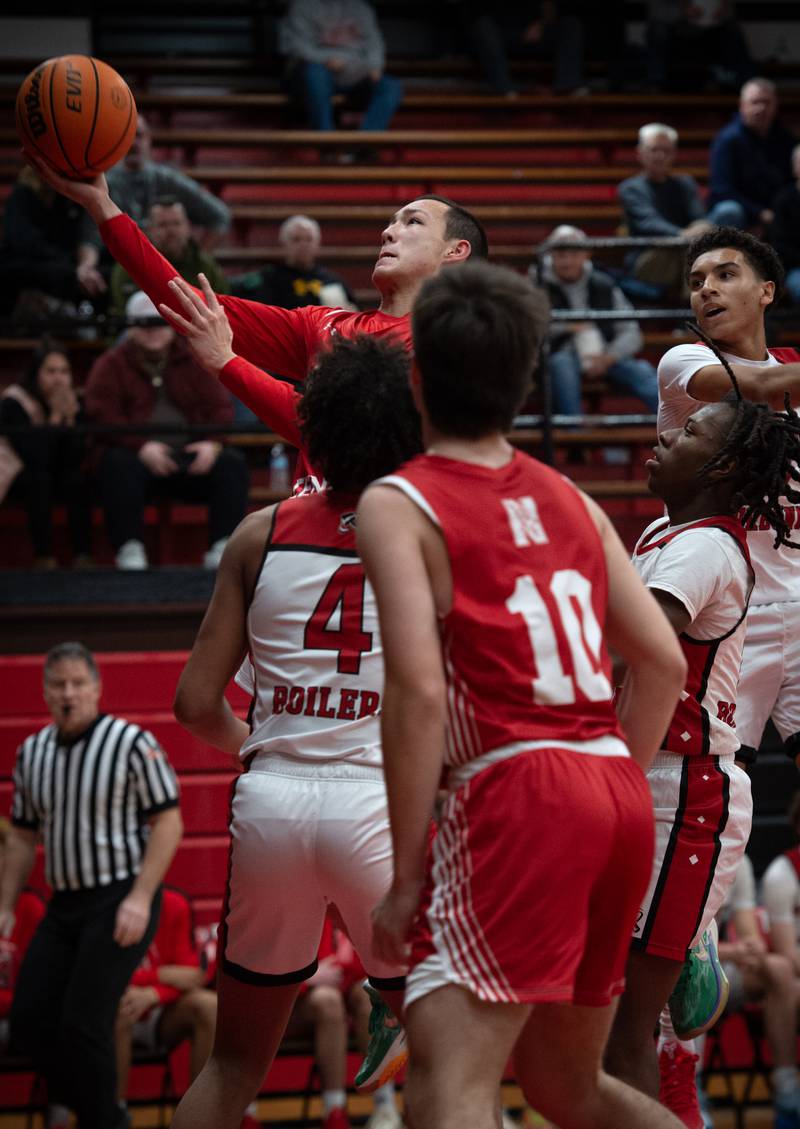 Naperville Central's Liam Lau puts up a shot in a game against Bradley-Bourbonnais on Monday, December 15, 2025.
