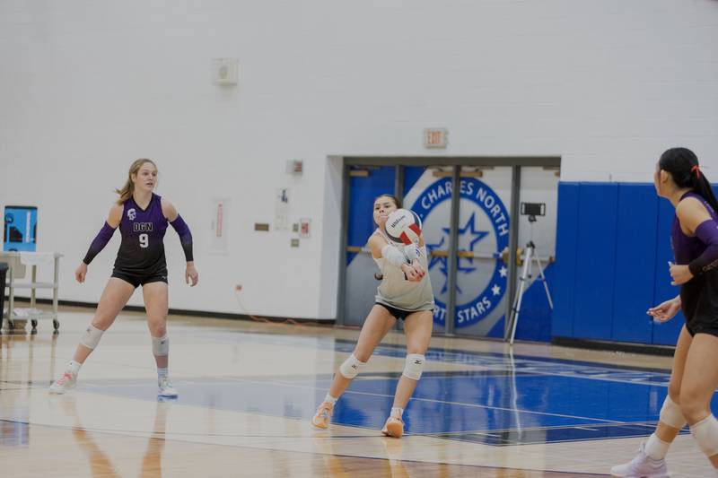 Downers Grove North's Angelika Krob returns the volley against St. Charles North on Thursday Oct. 23, 2025 in St. Charles.