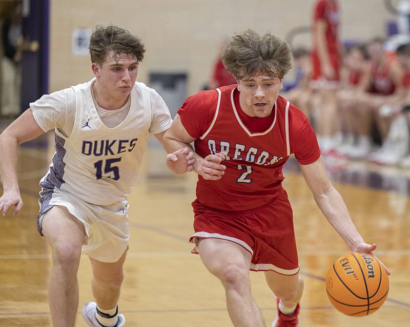Oregon’s Cooper Johnson drives to the hoop against Dixon’s Jimi Gosinski Tuesday, Feb. 3, 2026.
