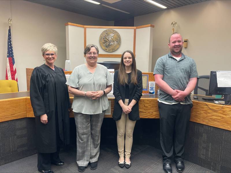 New advocates pose for a photo following the CASA swearing-in ceremony on Wednesday, June 11, 2025. From left: Judge Michelle Vescogni, Robin Axe, Heather Hayden and David Klassen.