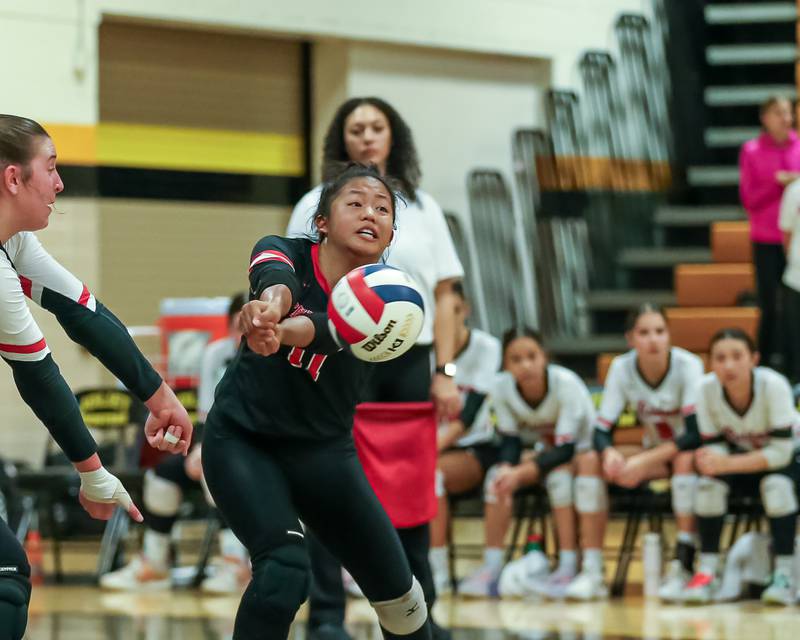 Bolingbrook's Alana Cruz (11) with a dig save during regional final volleyball match between Bolingbrook at Joliet West.  Oct 26, 2023.