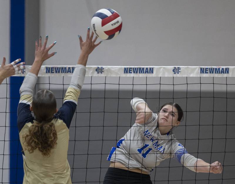 Newman’s Isabelle Lanning hammers a shot against Mercer County Wednesday, Sept. 24, 2025.
