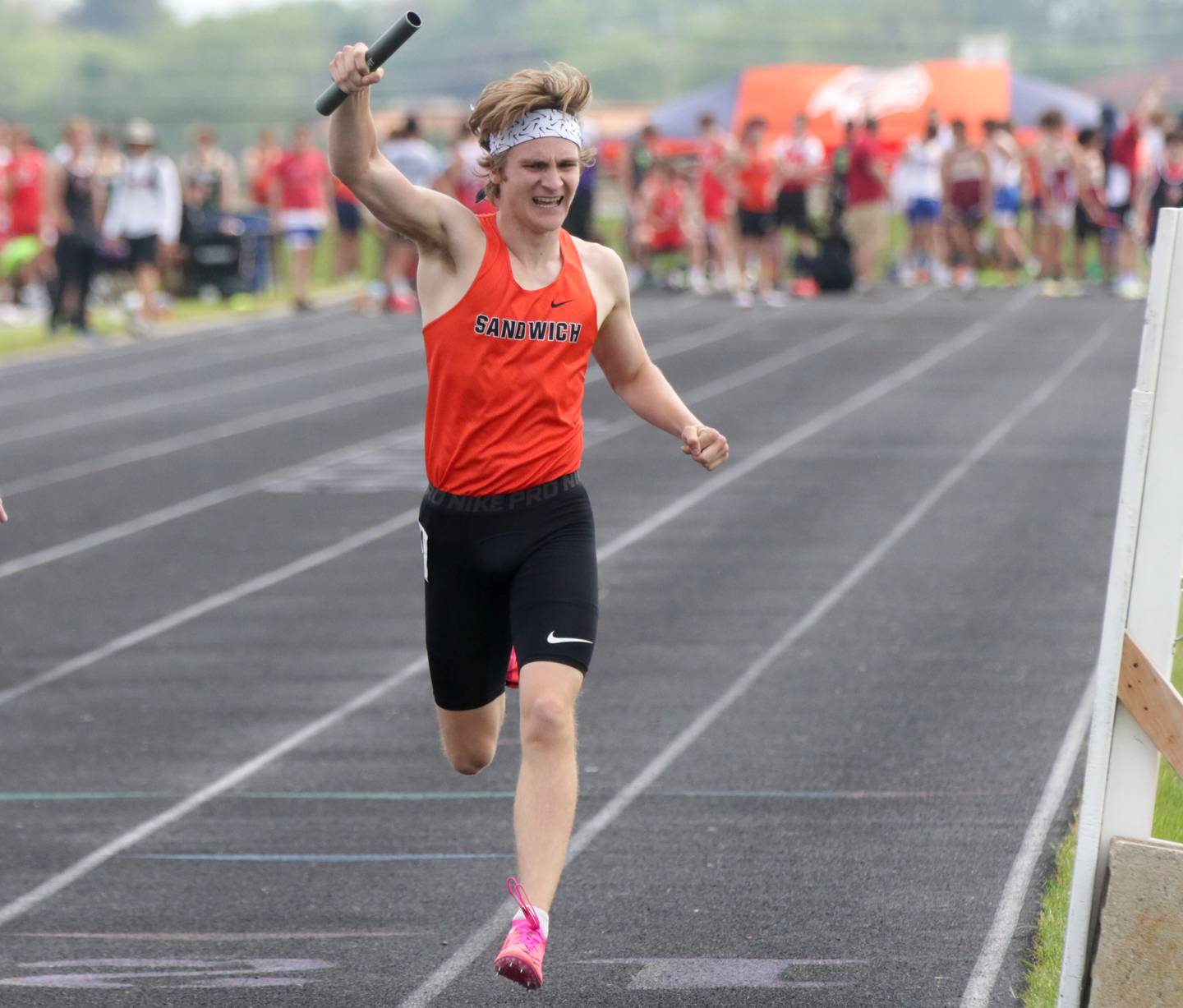 Sandwich's Wyatt Miller points toward the finish to win the 4x800 relay in the Class 1A Boys Sectional track meet on Friday, May 20, 2022 in Plano.