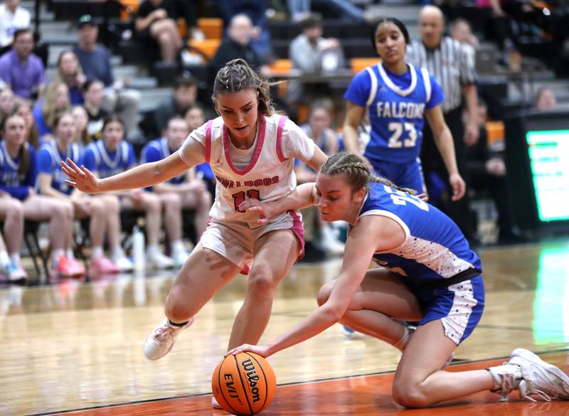 Batavia's Kaidyn King and Wheaton North's Brigitte Noyes go after a loose ball during a Class 4A St. Charles East Sectional semifinal on Tuesday, Feb. 25, 2025 in St. Charles.