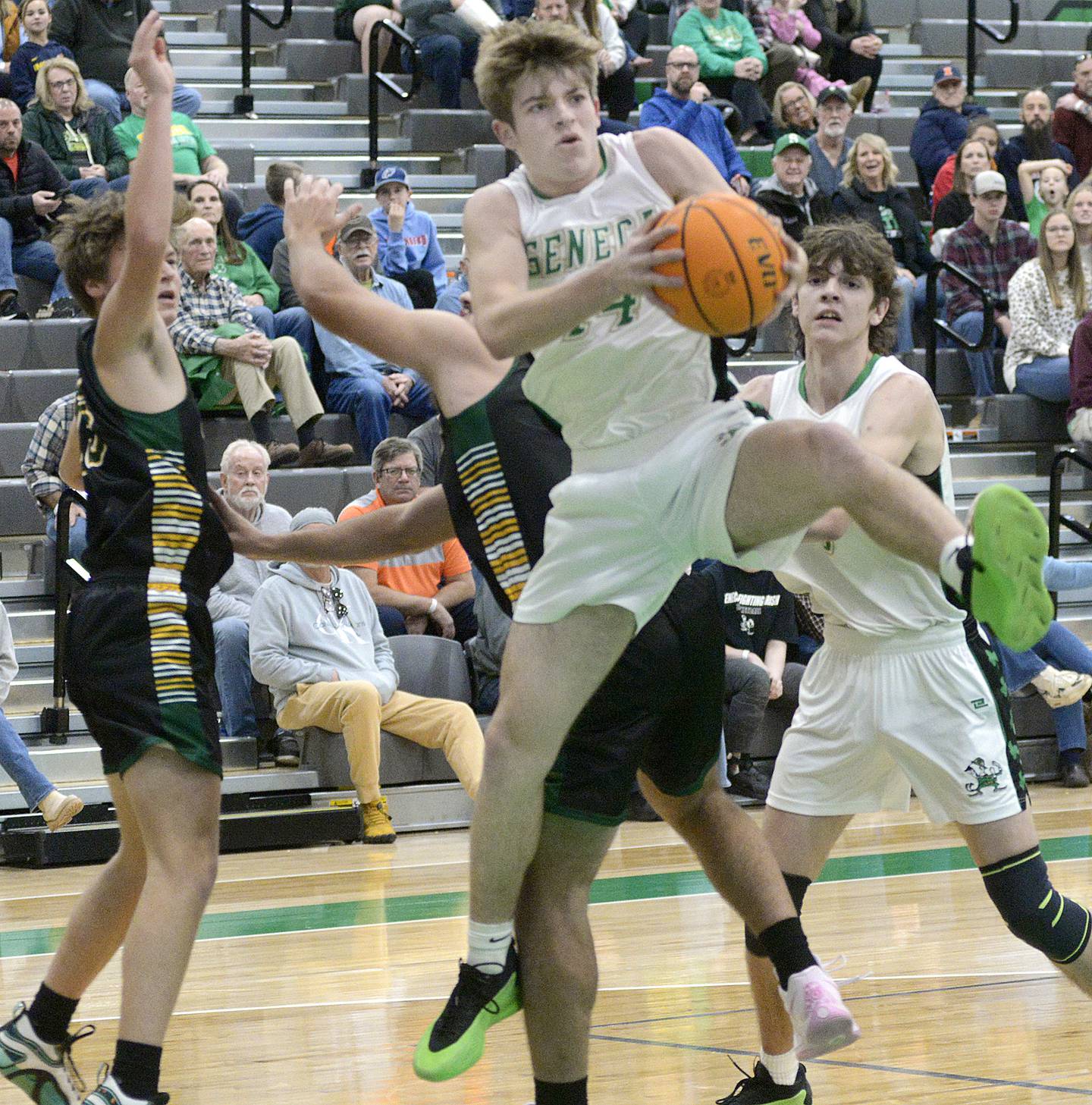 Seneca’s Cameron Shriey pulls down this rebound against Coal City first period Friday during the semifinals of the Shipyard Showdown Tournament hosted by Seneca High School.