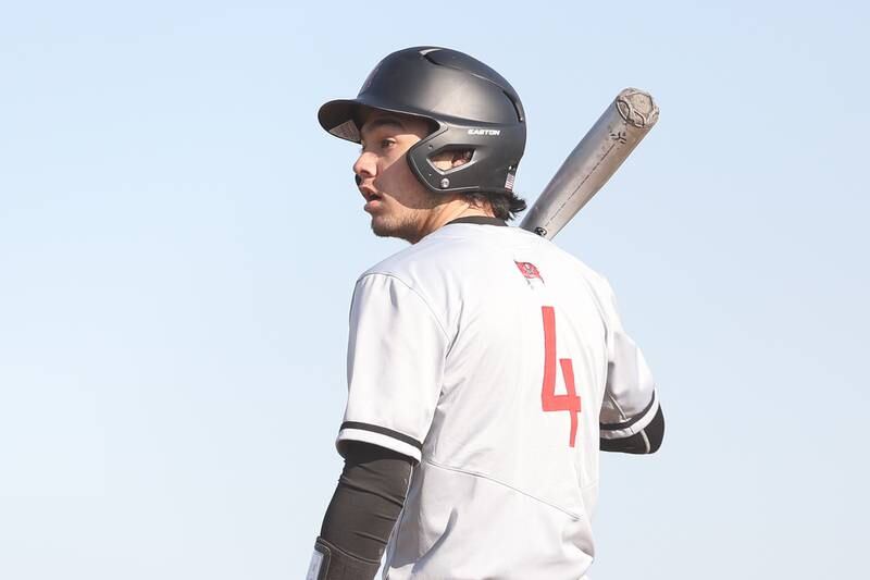 Bolingbrook’s Jack Vodvarka looks to third for the sign before batting against Plainfield East on Monday, March 27, 2023.