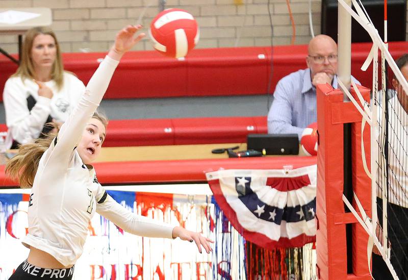 Sycamore's Laci Neece spikes the ball to the Ottawa side of the net on Thursday, Oct. 12, 2023 at Kingman Gym.