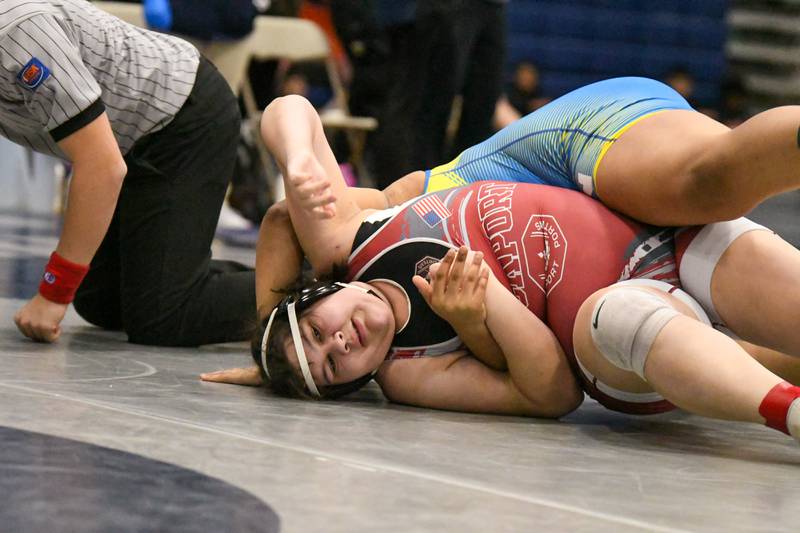 Rebekah Ramirez of Lockport escapes from Iana Victory of Wheaton North grip during the 235-weight class championship match where Rebekah took the win with a pin on Saturday Jan. 5, 2025, during the Aaron Dundley invite held at Oswego East High School.