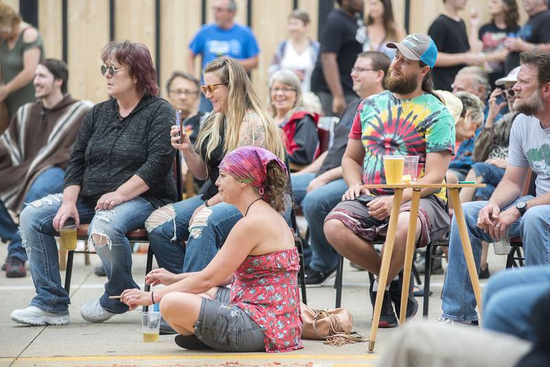 Fans listen to music at Rosbrook Studio’s street fair Saturday, June 11, 2022 in downtown Dixon. The music lineup was diverse, running from 3 pm to 10 pm with more than 50 musicians taking part in the music and art venue fundraiser.