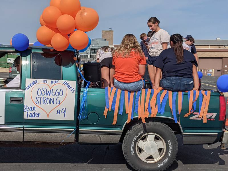 Sean Fader, a senior at Oswego High School, died on Sept. 13 after the car he was driving hit a tree in Oswego Township and caught fire. During Oswego High School’s homecoming parade on Oct. 15, signs like “You will be missed Sean” and “Forever in our Hearts” were on display.