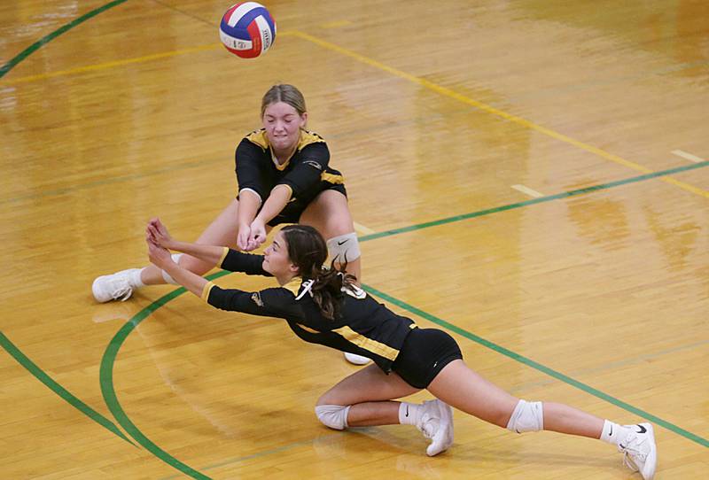 Putnam County's Ava Hatton and teammate Tori Balma dive for the ball while playing Henry-Senachwine in the Tri-County Conference Tournament on Monday, Oct. 10, 2022 in Seneca.