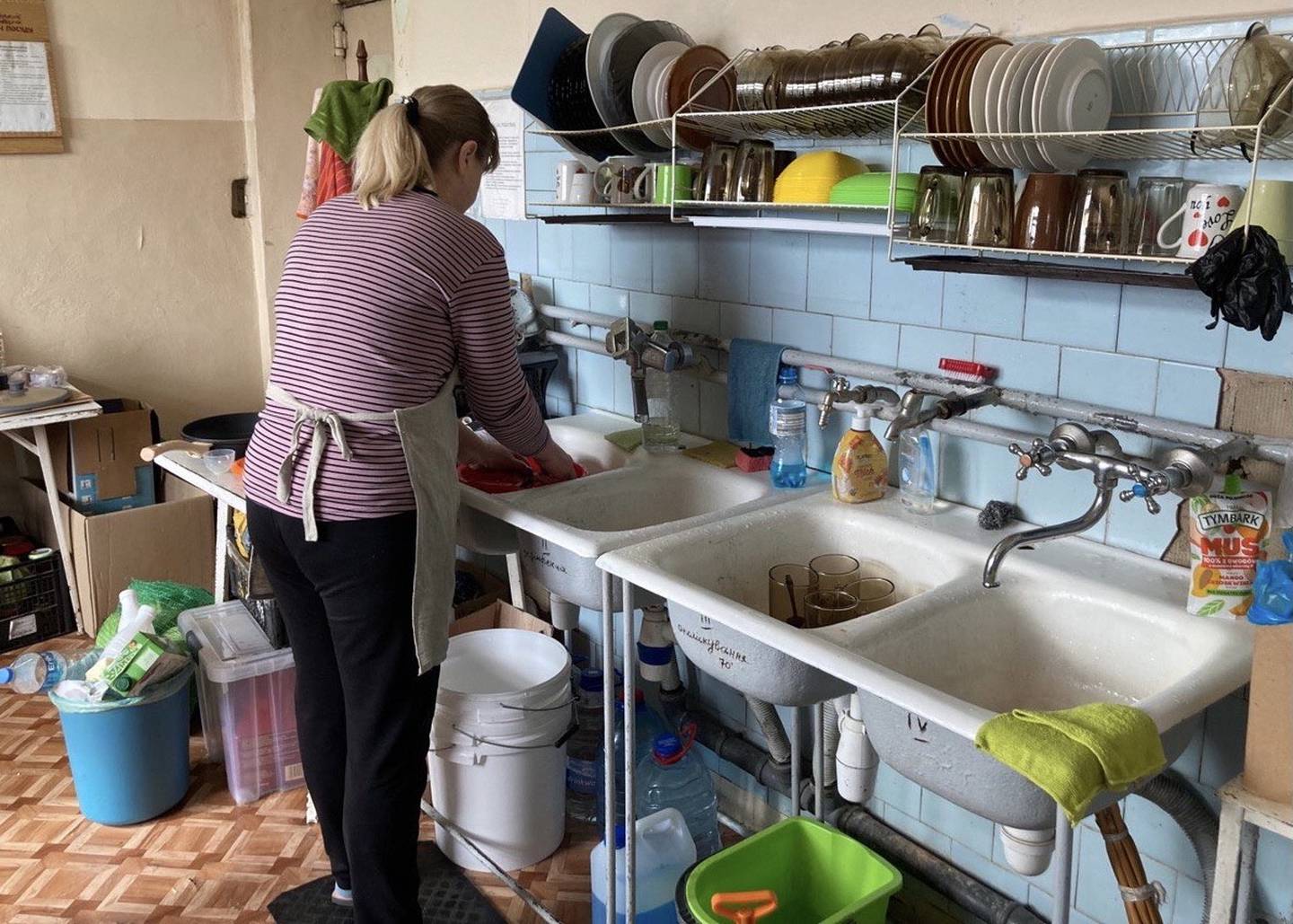 Refugees cooked and cleaned in the base camp as a way to help and make money. (photo provided)