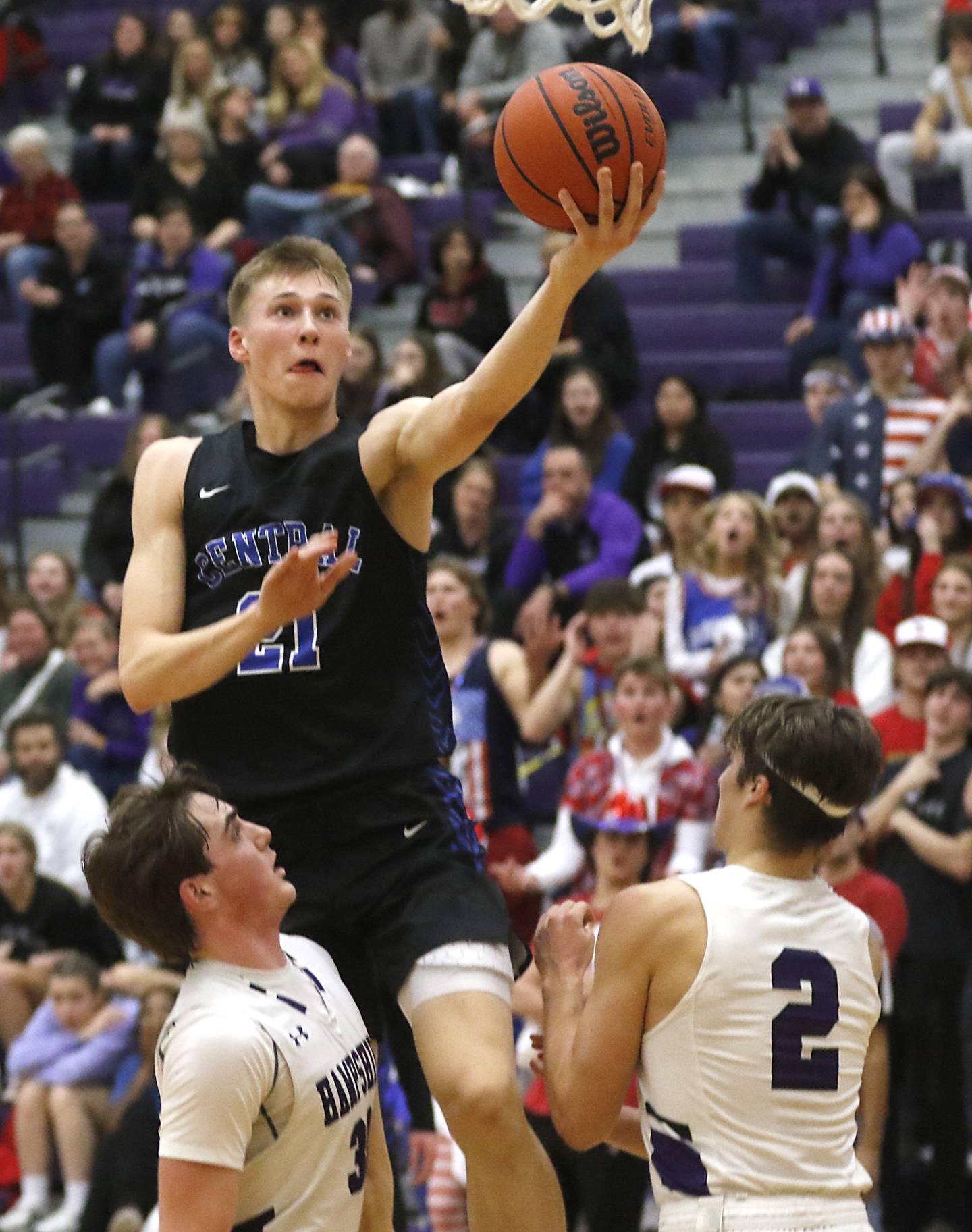 Burlington Central's Andrew Scharnowski drives to the basket over Hampshire’s Sam Ptak and Joey Costabile during a Fox Valley Conference boys basketball game Friday, Jan. 20, 2023, at Hampshire High School.