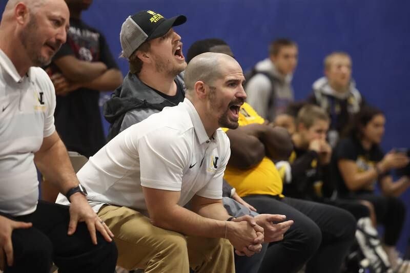 Joliet West head coach Charles Rumpf yells out to Carson Weber during his match against Romeoville’s TJ White in a dual meet on Thursday, Dec.14th, 2023 in Romeoville.