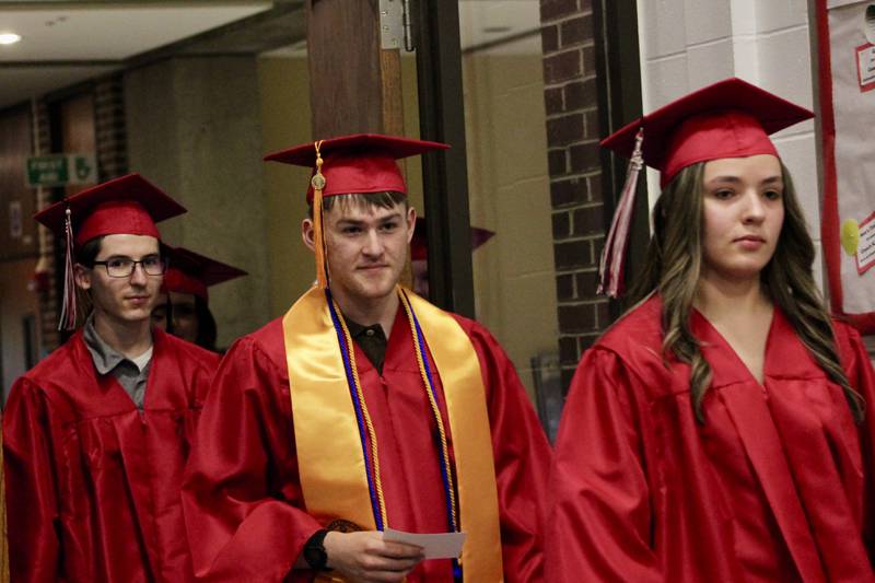 Graduates begin the processional into the gym for Sauk Valley Community College commencement on Friday, May 12, 2023.