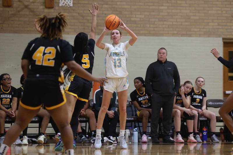 Joliet Catholic’s Abigail Dulinsky puts up the outside shot against Marian Catholic on Monday, Dec. 9, 2024 in Joliet.