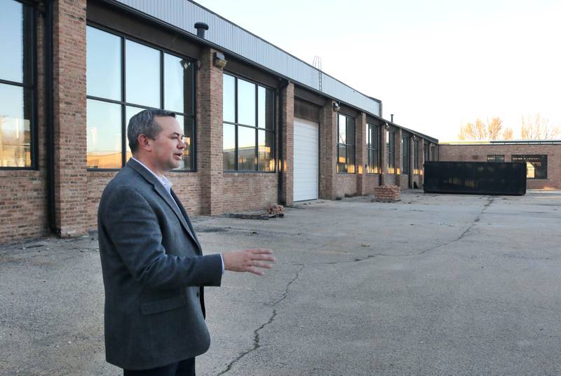 Mike Gilbert, of CM Capital Management, talks about some of the features they are planning for the outside of one of the buildings during a tour of the property at 421 North California Street Monday, Nov. 13, 2023, in Sycamore. Local businessman Chris Mayer hopes to renovate the existing industrial buildings into a distillery, restaurant and event space.