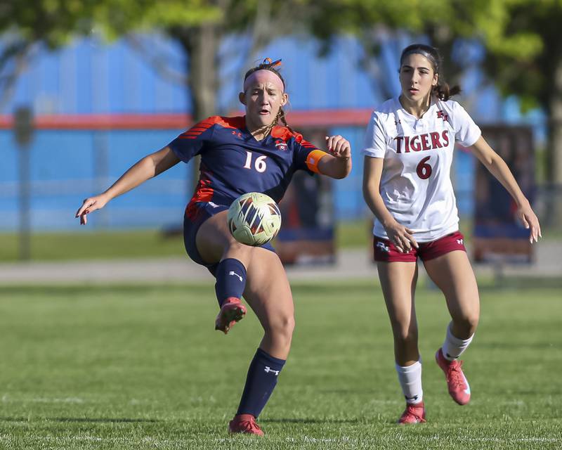 Oswego's Peyton Johnson (16) kicks the ball during a soccer match between Plainfield North at Oswego on Monday, May 11, 2026 in Oswego.