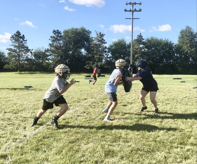 The Bureau Valley Storm run drills during Tuesday's football practice at Bourquin Field in Manlius.
