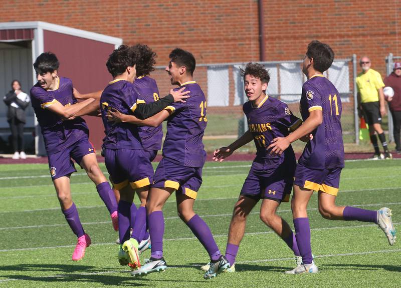 Members of the Mendota soccer team react after teammate David Casas scores a goal in the second overtime period against Quincy Notre Dame during the Class 1A Sectional semifinal game on Saturday, Oct. 21, 2023 at Illinois Valley Central High School in Chillicothe.